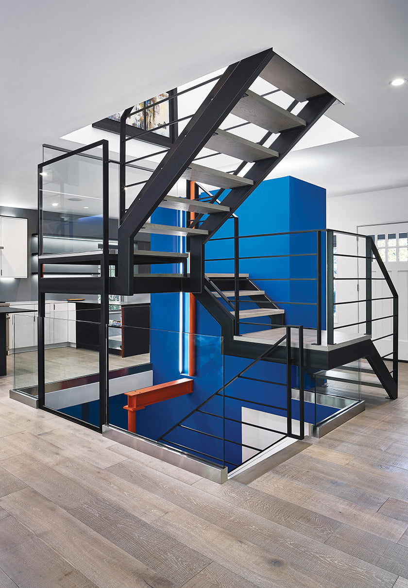 A steel staircase is a central feature of the remodeled home.