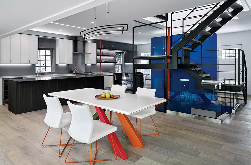 The kitchen and dining area help frame the stair.