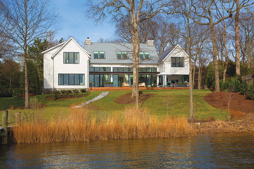 Charles Owen of Fine Landscapes added steps to access the dock and a privacy screening of Nellie Stevens holly.