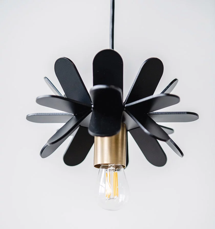 Newly fabricated, painted aluminum in the form of a modern flower.