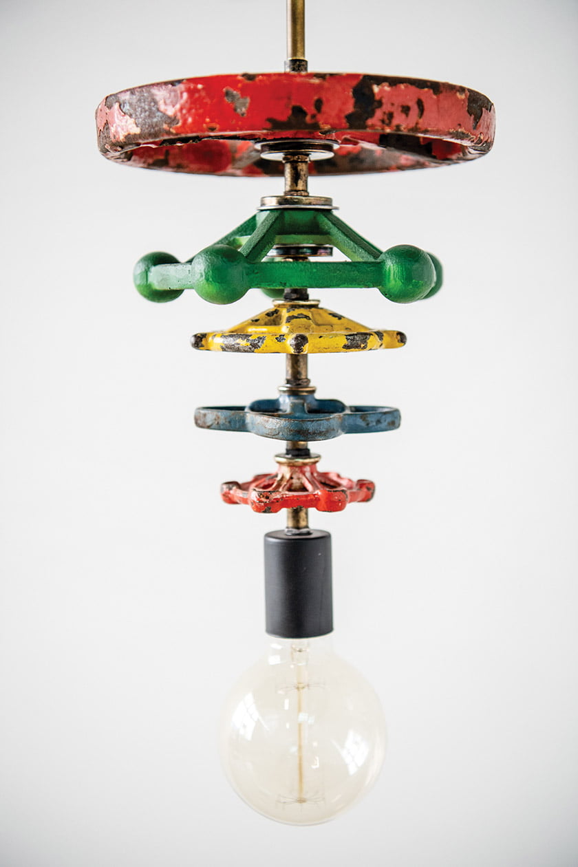 Umanoff shaped bold pendants from vintage valve handles.