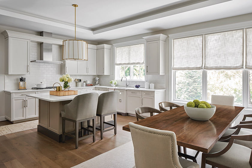 Handcrafted side chairs in the breakfast area are an updated take on the classic Wishbone design.