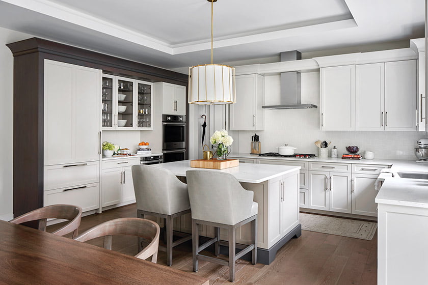 Over the kitchen island, Morris hung a Visual Comfort drum pendant from Circa Lighting.
