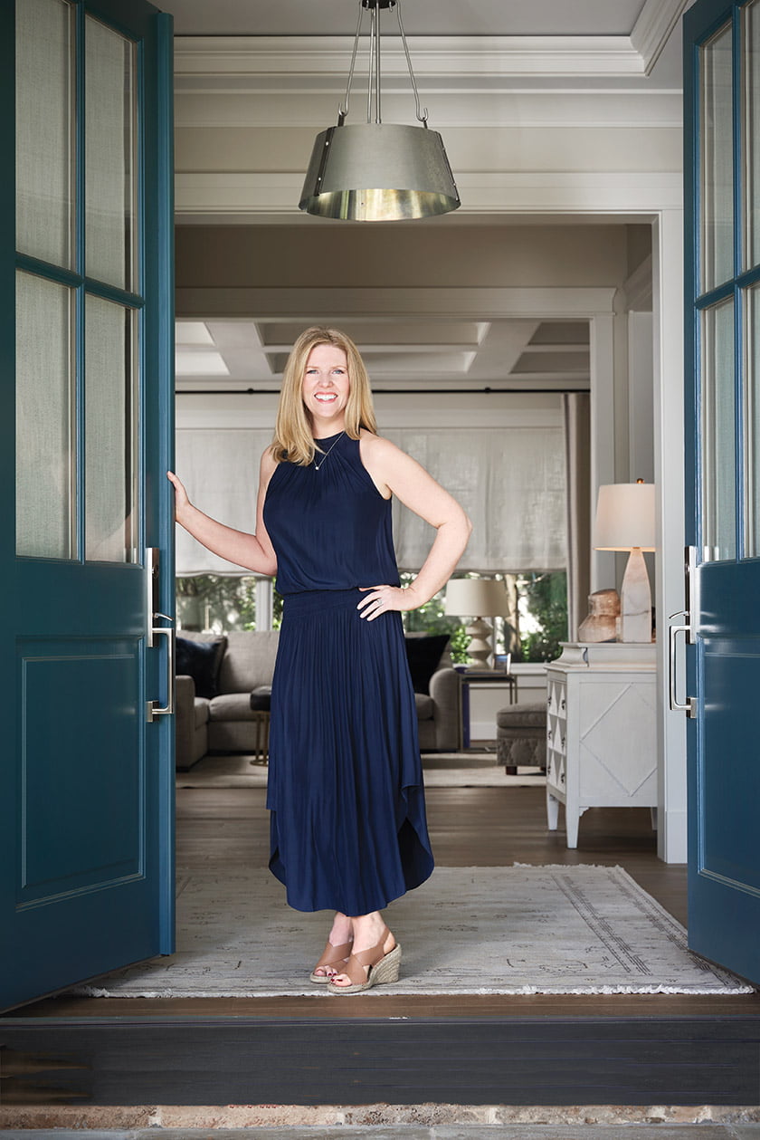 Morris poses at her front door, painted Benjamin Moore’s Narragansett Green.