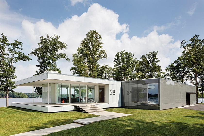 Home exterior is sheathed in colored glass cladding system by Sto