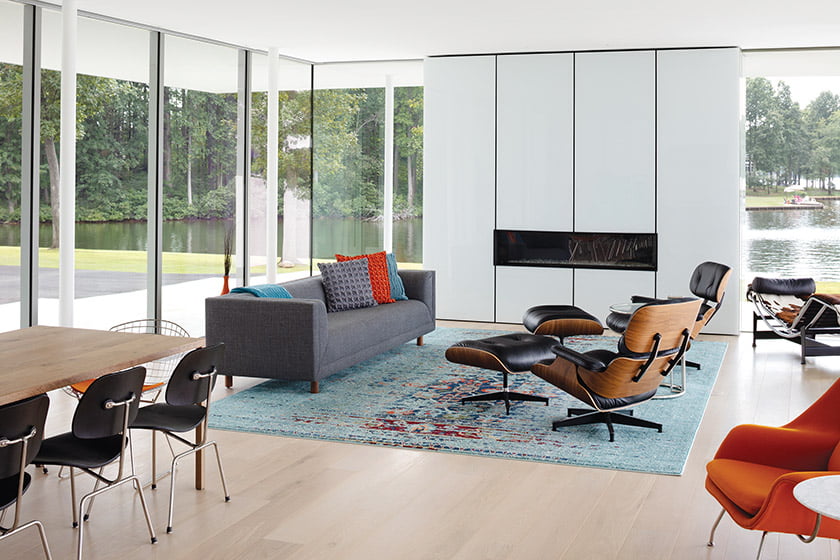 Great room with Safavieh rug Herman Miller sofa and Eames lounge chairs and ottomans