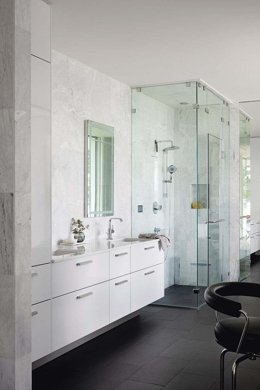 Owners bath with statuary marble wall tile from Best Tile and Grohe plumbing fixtures