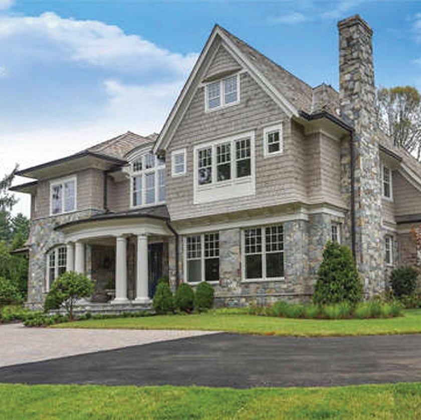A warm mix of materials, from cedar shakes to stone