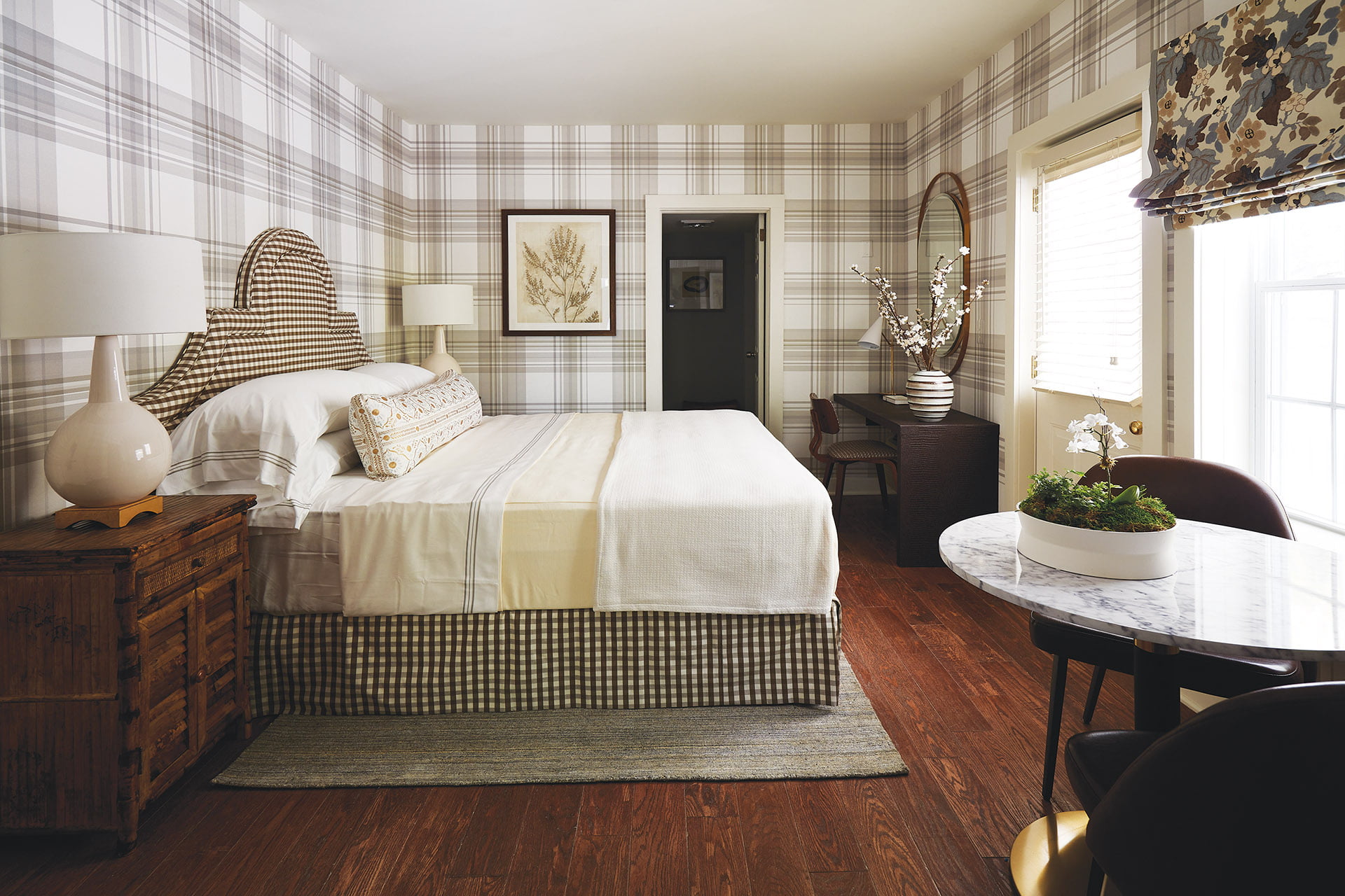 British style bedroom with checks and plaids dominating a floral window shade.