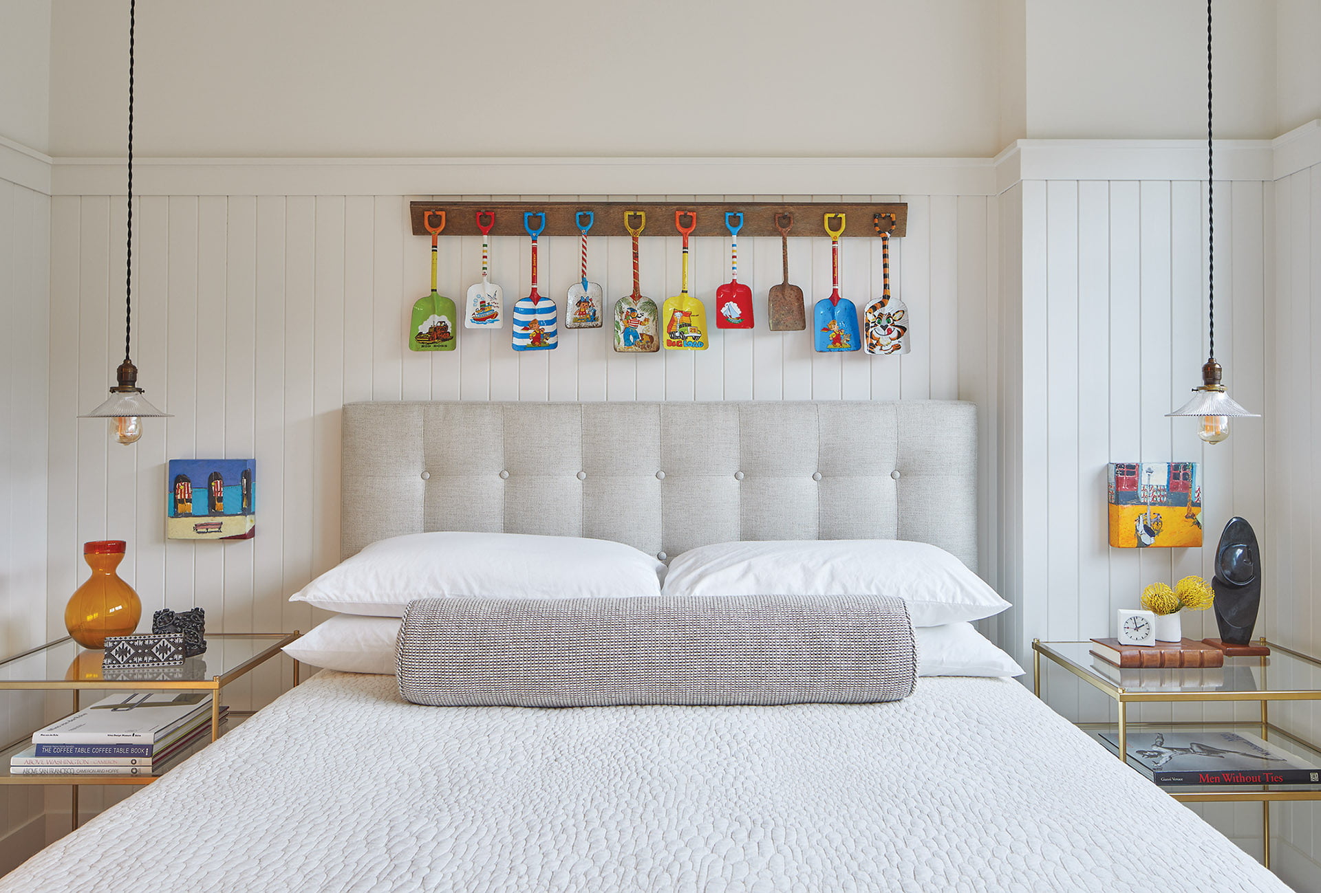 Vintage sand shovels, sourced on eBay and antique floor board hang over headboard