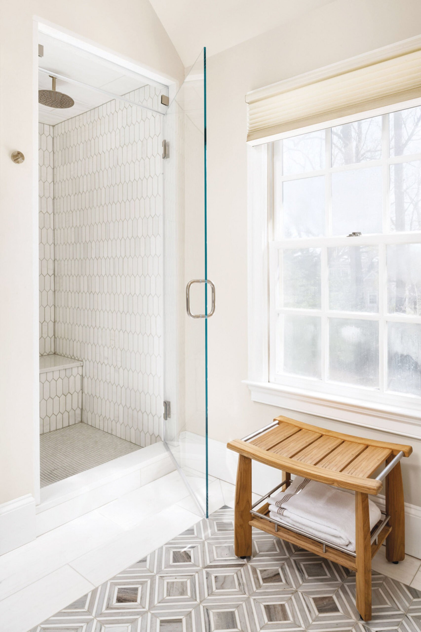 Shower stall in white tile.