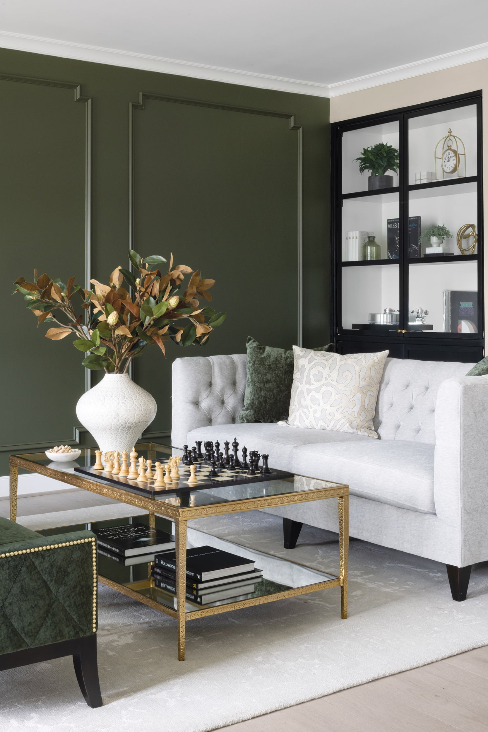 Living room, Benjamin Moore’s Chimichurri paint and custom shelf system