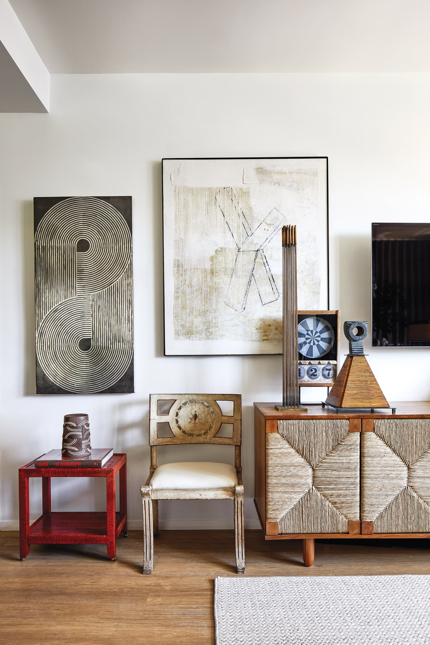 18th-century Italian chair and modern graphite-and-concrete piece by Stephen Benedicto