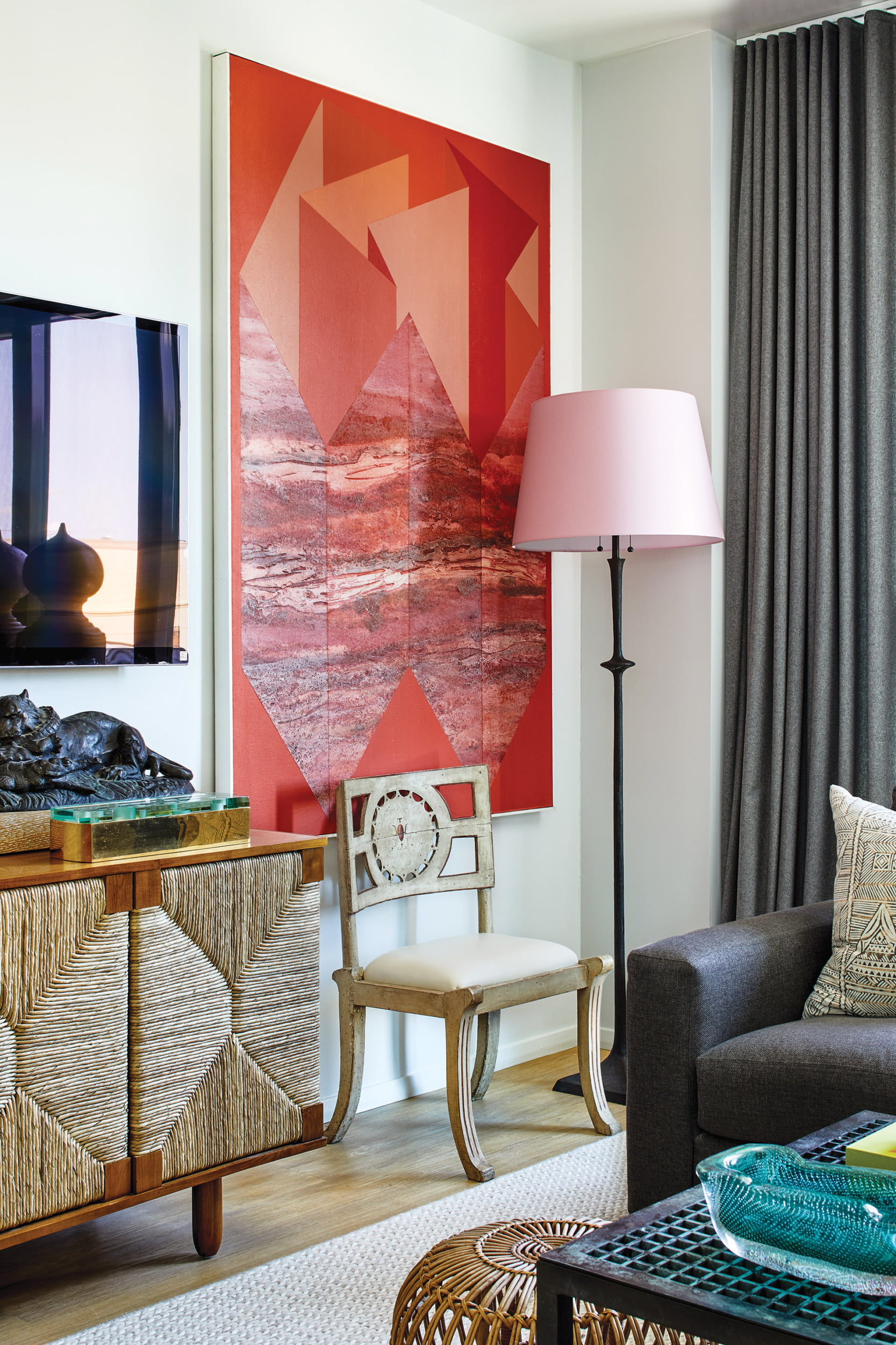 Sculpture by 19th-century animalier Antoine-Louis Barye on teak-and-rush Noir Furniture chest and James Twitty painting