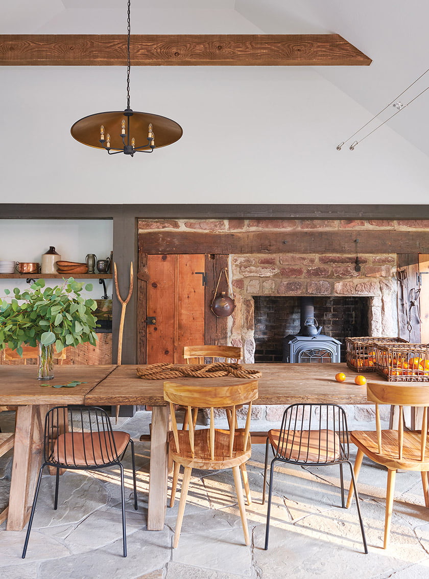 Log cabin with valued ceiling and stone fireplace