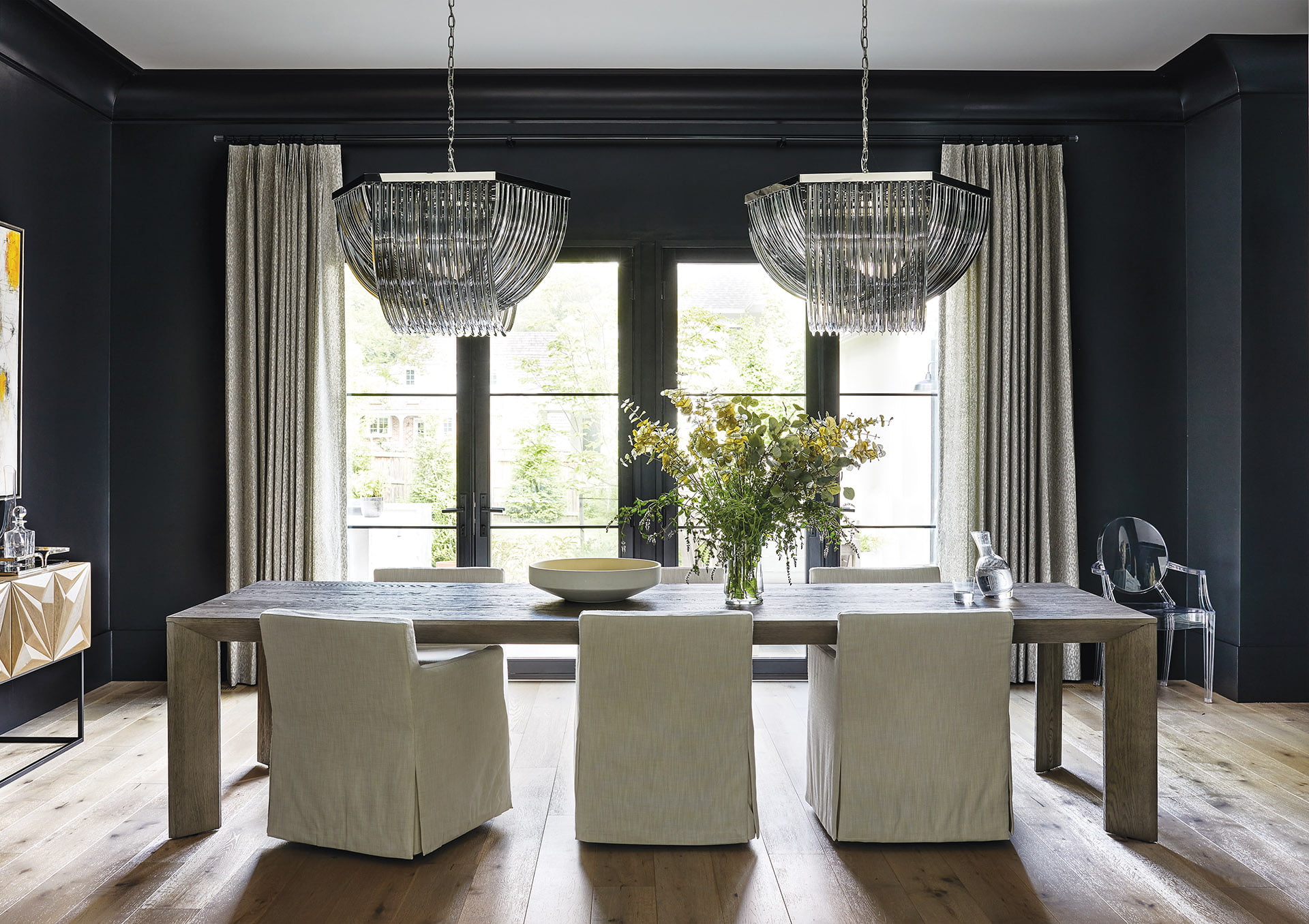 Dining room chandeliers from Sunpan and Jeffrey Alan Marks draperies.