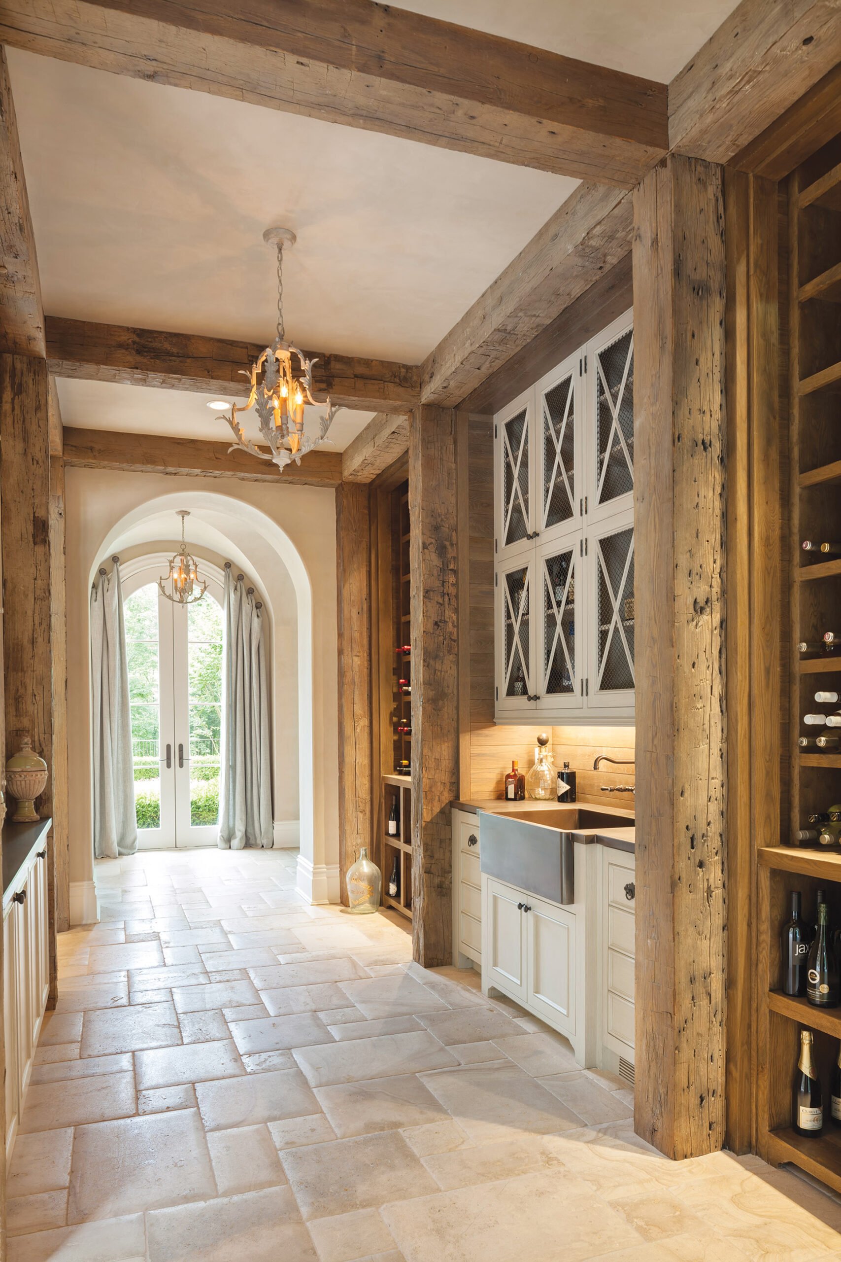 Century-old timbers enliven a bar and wine cellar tucked into a side hall.