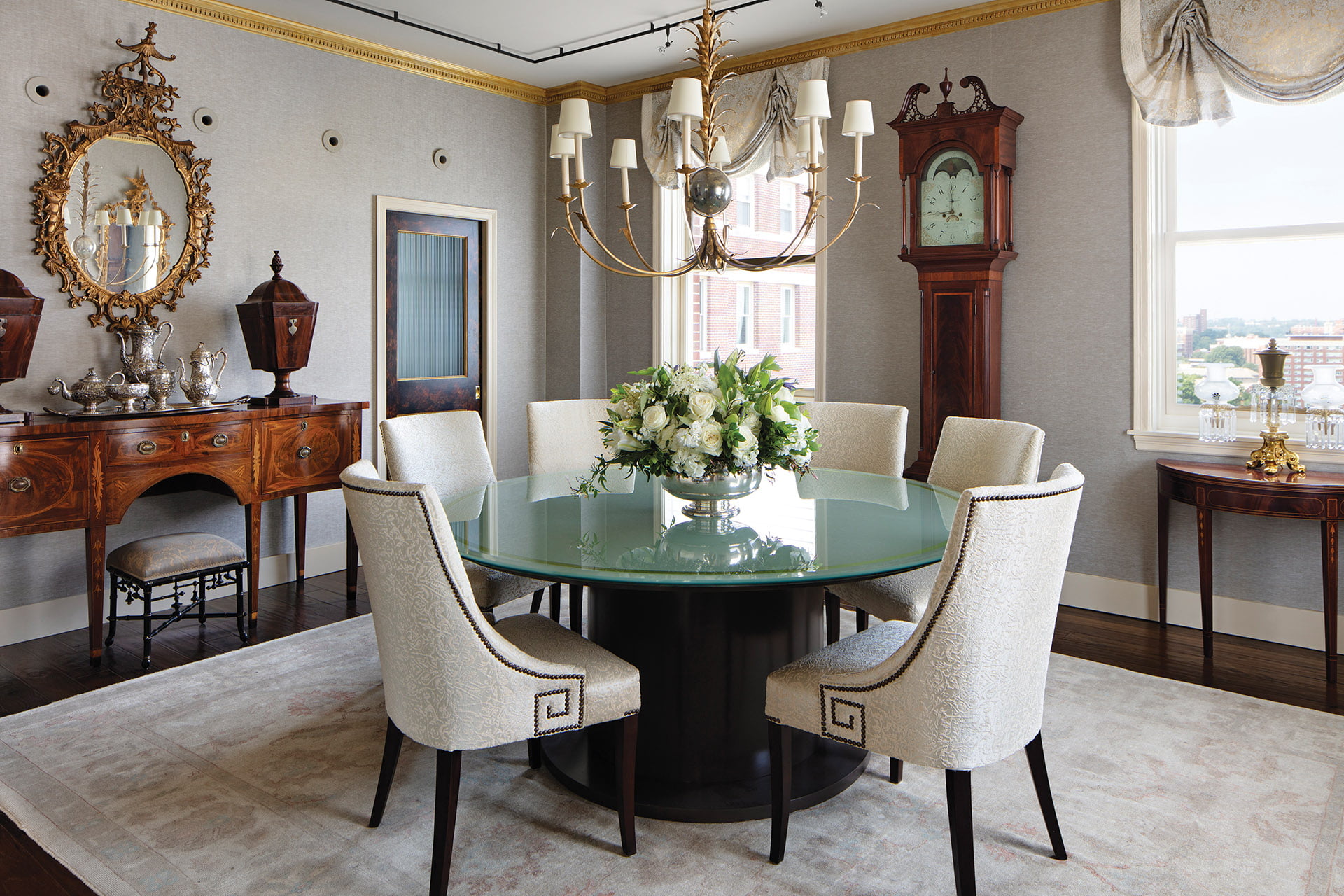 Contemporary dining room table and Lee Industries chairs covered in Holly Hunt fabric.
