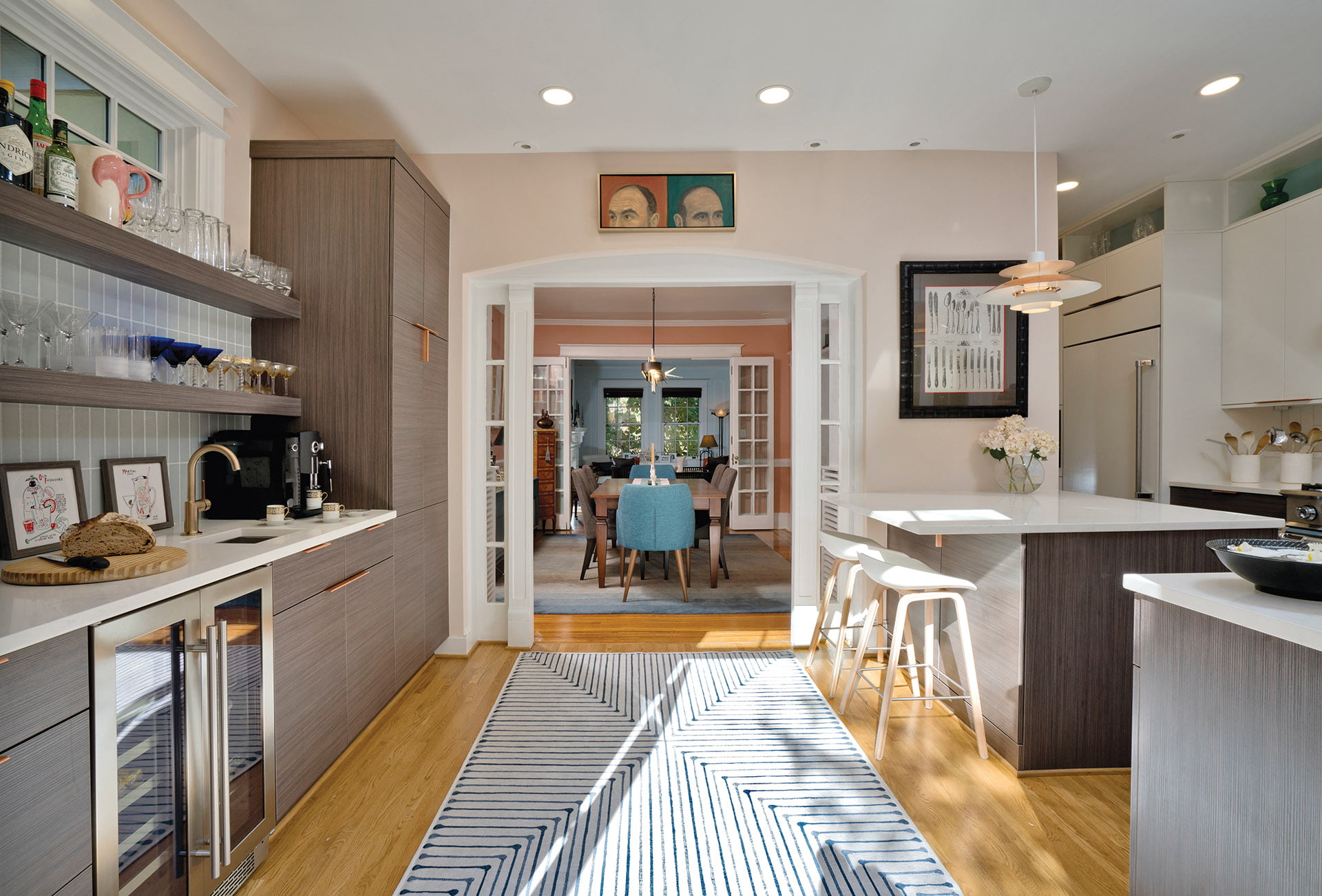 French doors reveal a symmetrical entryway into the dining room
