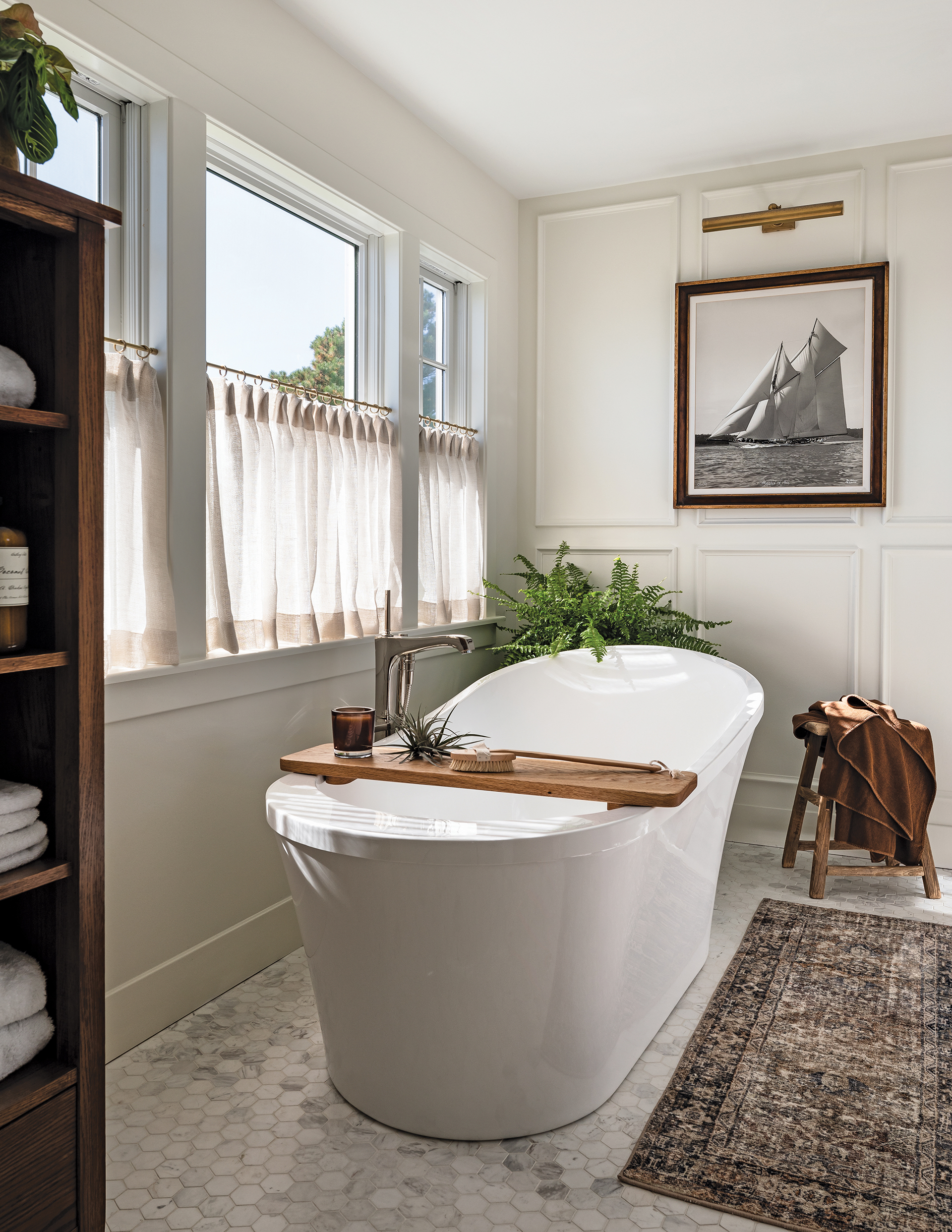 Luxe soaking tub positioned for natural light | Home and Design Magazine