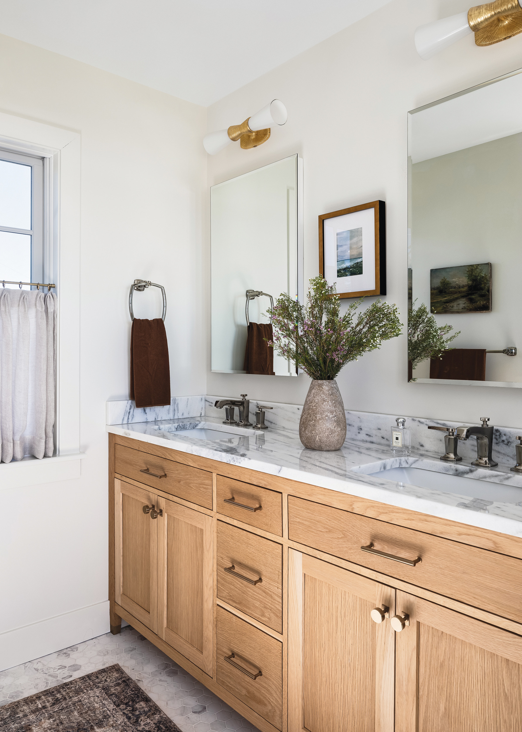 Ensuite bathroom with organic wood tones and marble surfaces | Home and Design Magazine