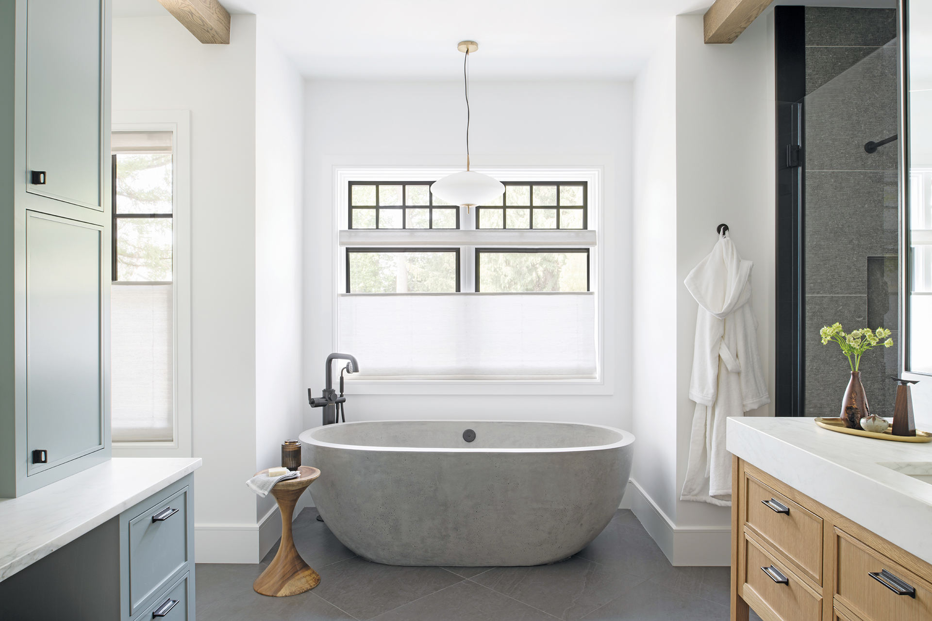 Interior Matter design featuring a slate floor and a sleek tub for a modern bathroom aesthetic | Home and Design