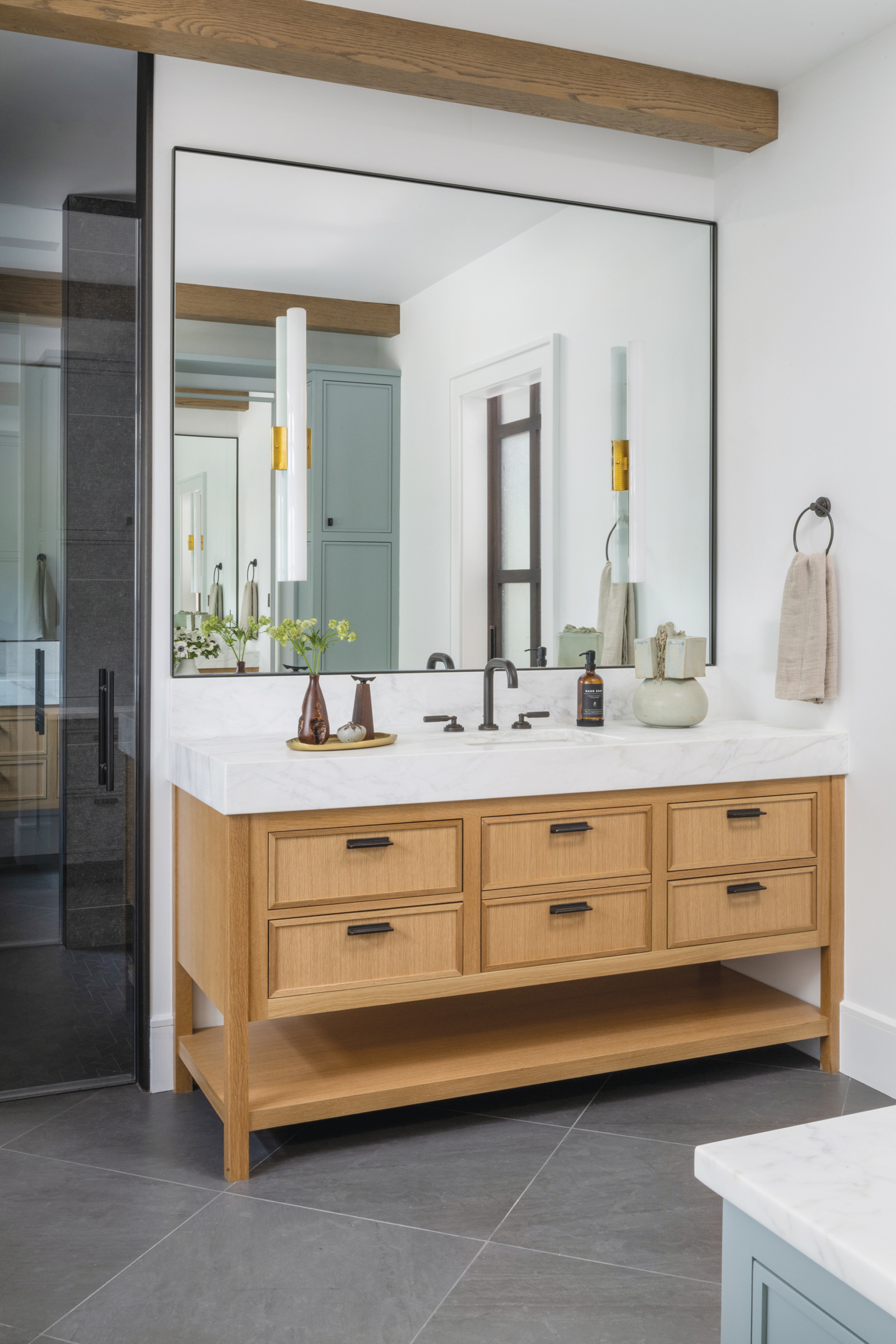 Modern bathroom with slate floor and sleek tub by Interior Matter | Home and Design