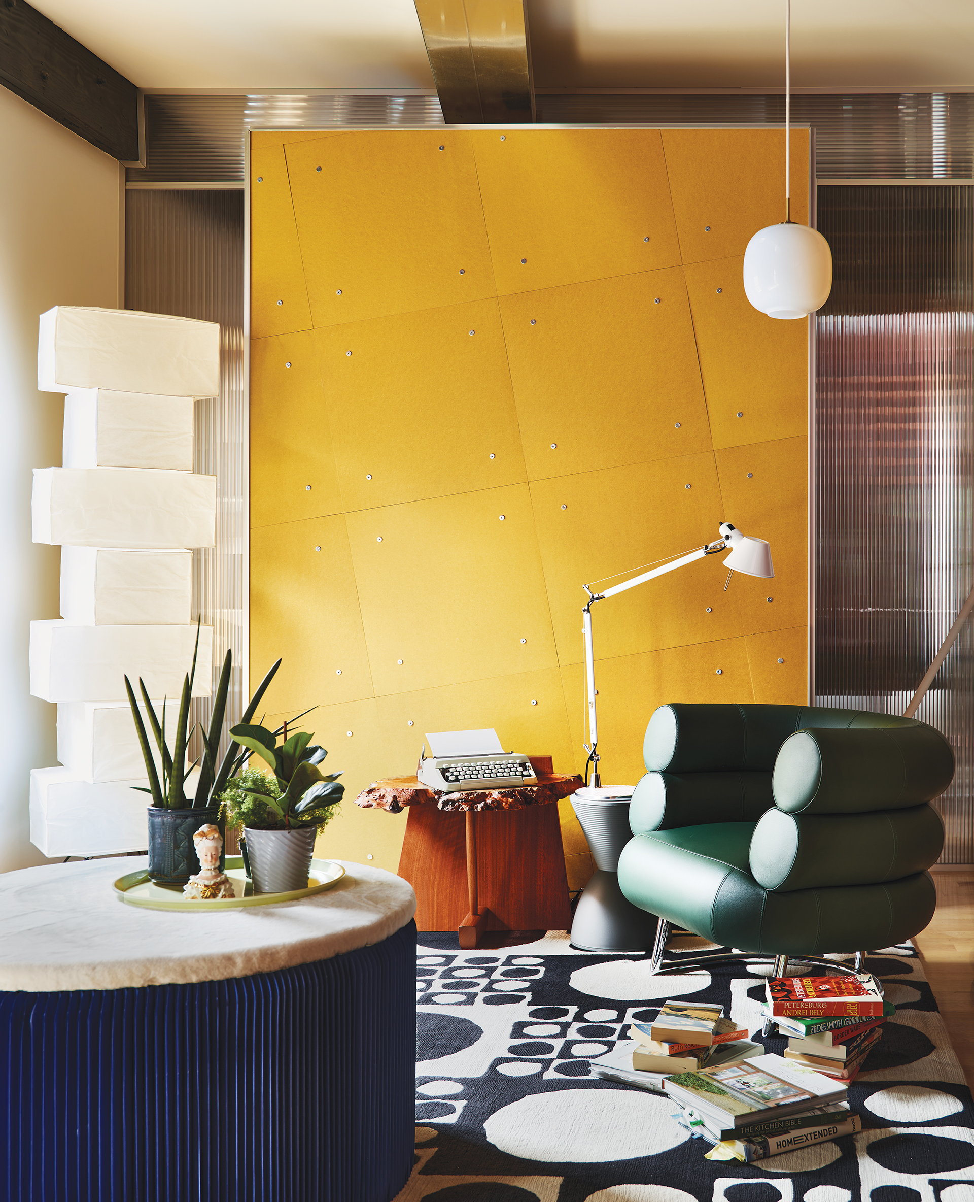 Second-floor reading nook with yellow Fairmat panel, Eileen Gray chair, and Noguchi lamp | Home and Design Magazine