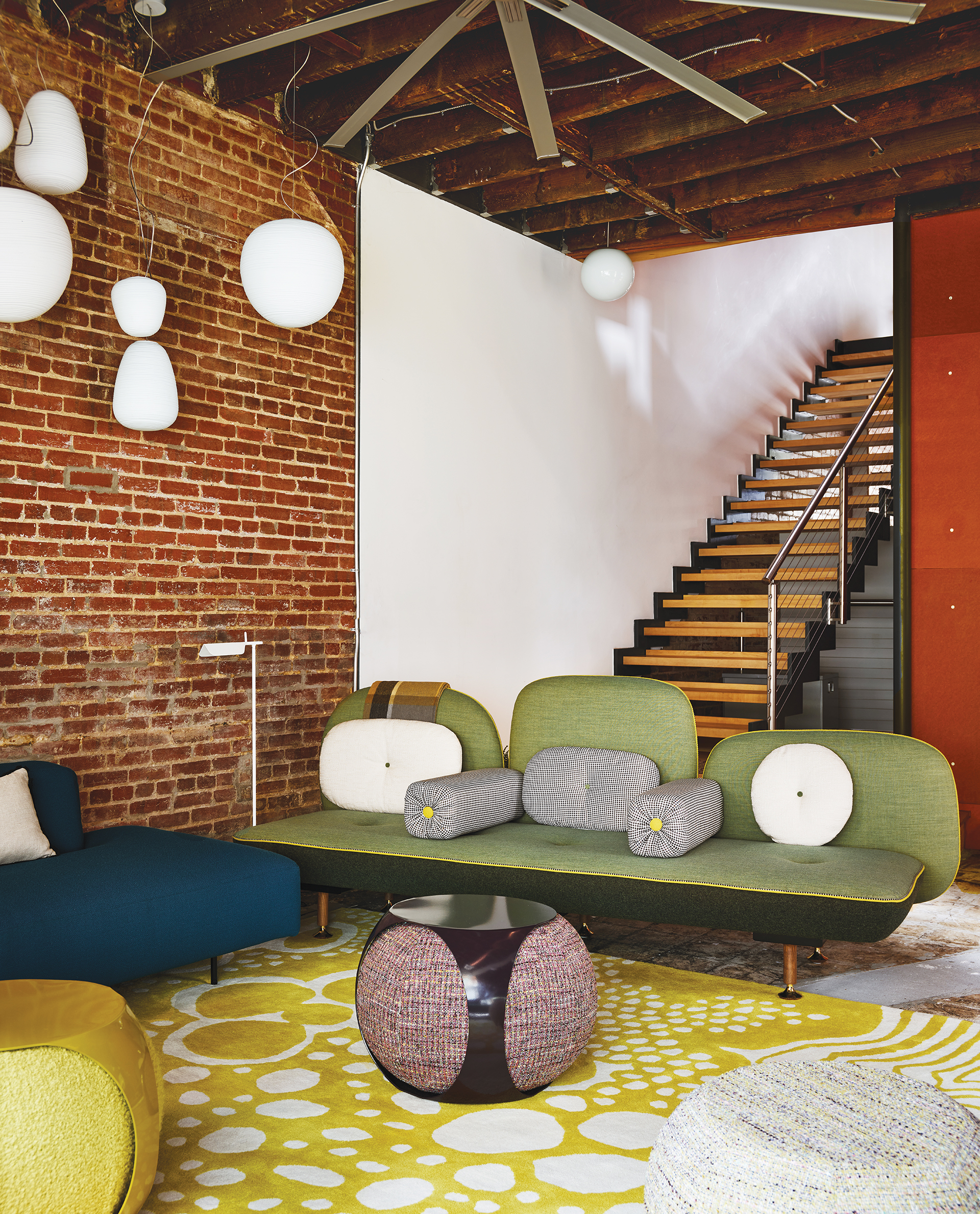 Open stairs connecting the home’s three levels | Home and Design Magazine
