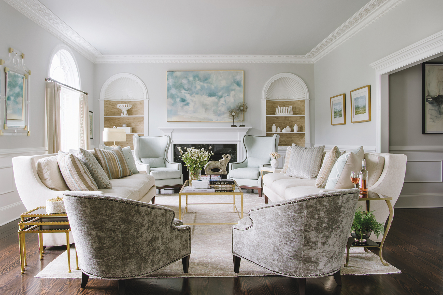 Living room designed by Carol Wheeler featuring Wesley Hall chairs, Kravet draperies, and a Loloi rug in soothing hues | Home and Design