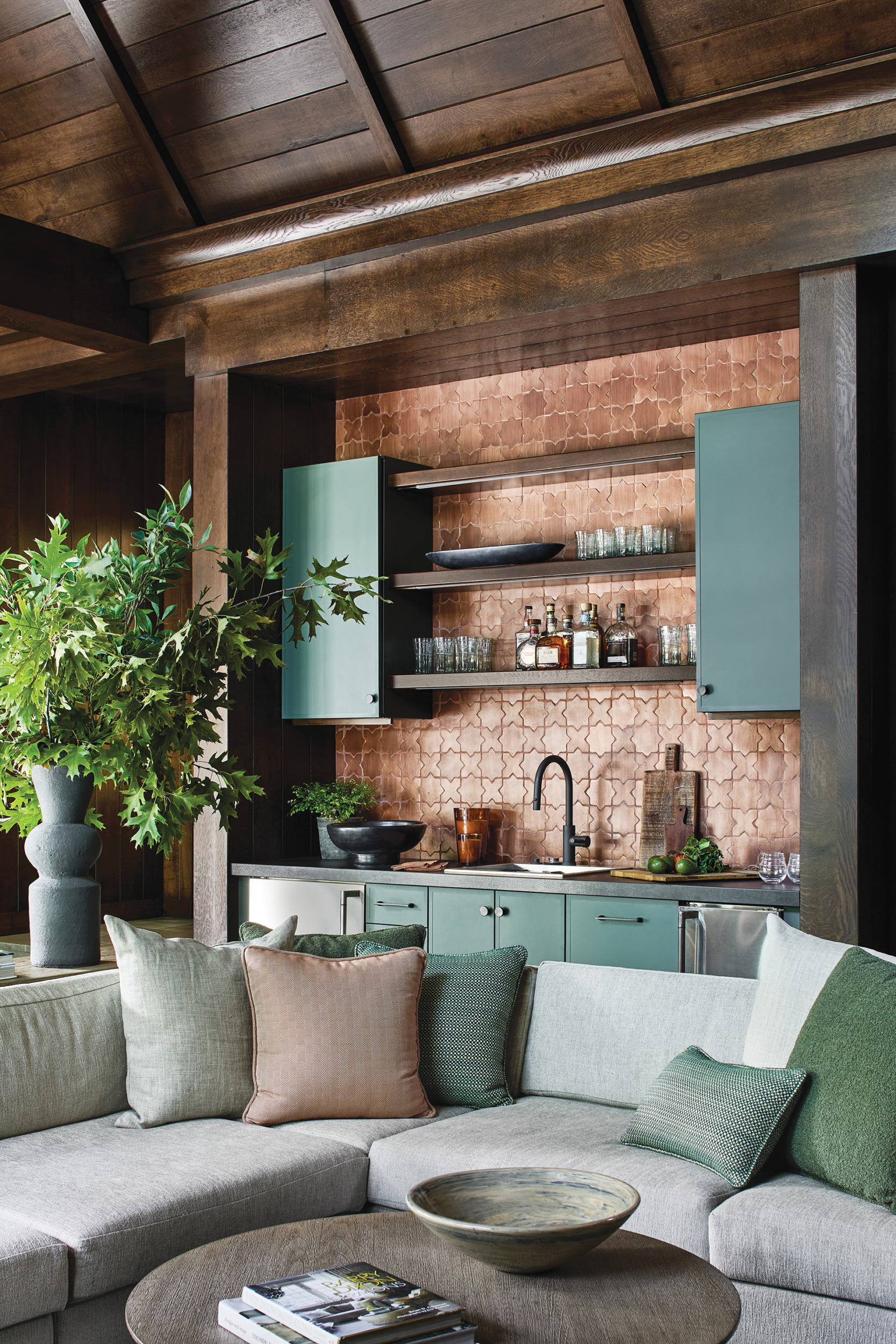 Kitchenette with powder-coated stainless-steel cabinetry in green and terracotta-tile backsplash | Home and Design