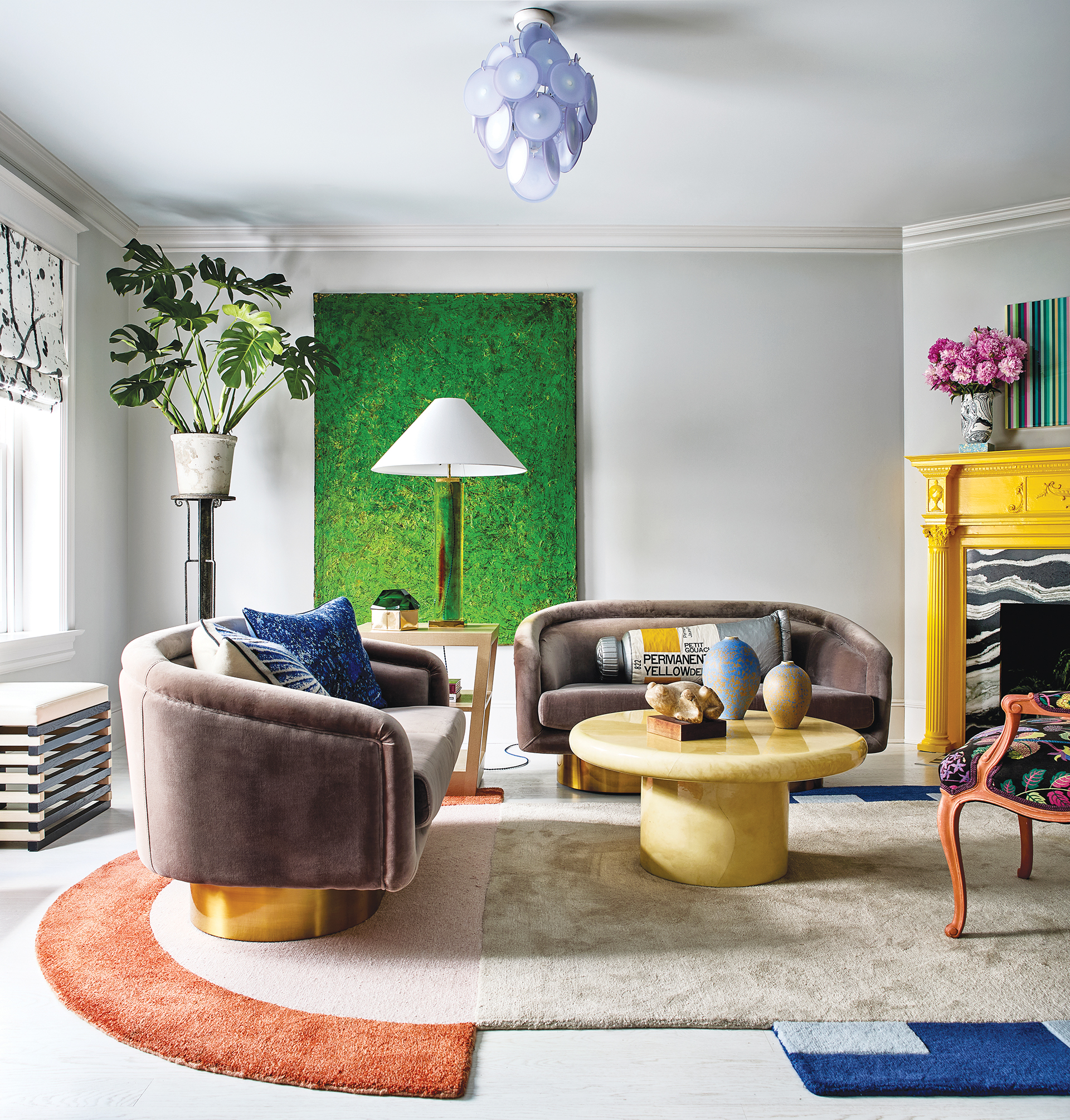 Twin Murano glass chandeliers elegantly connect the foyer and living room | Home and Design Magazine