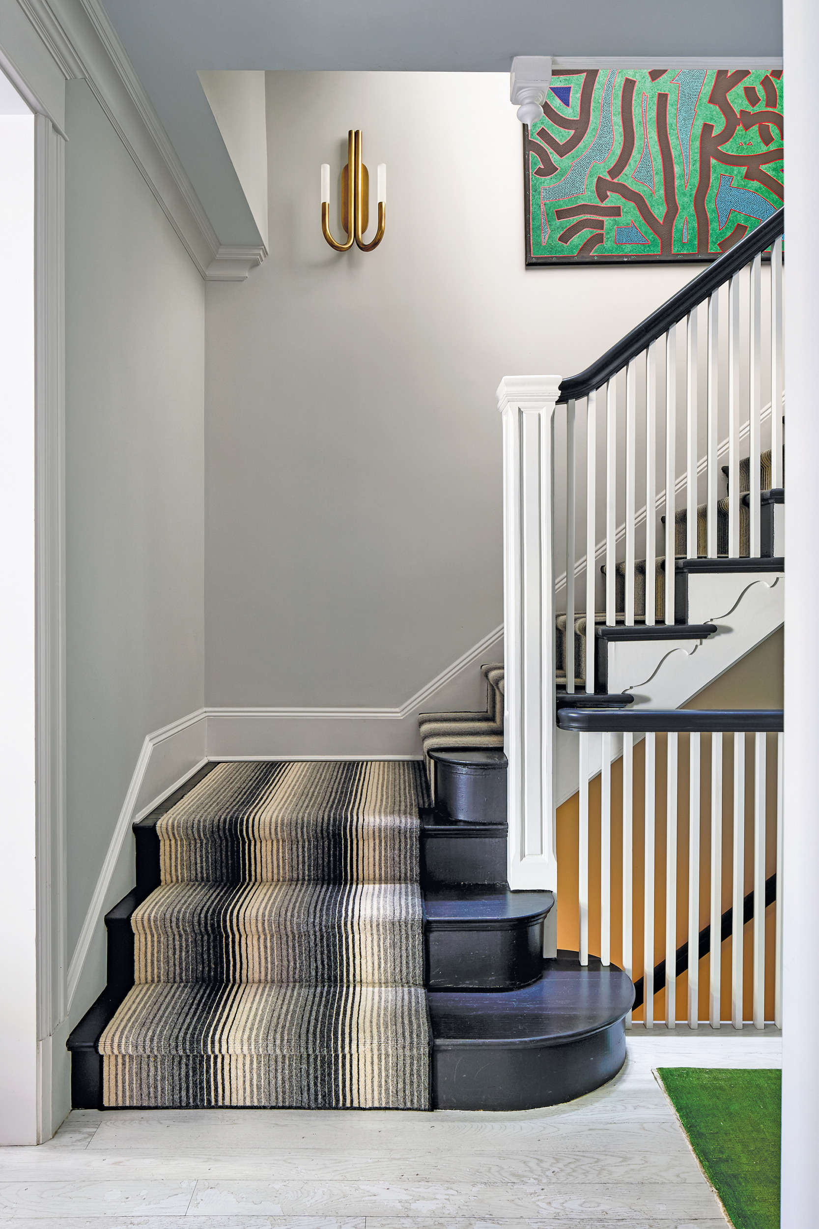 Original stairway with black-painted treads and risers | Home and Design Magazine.