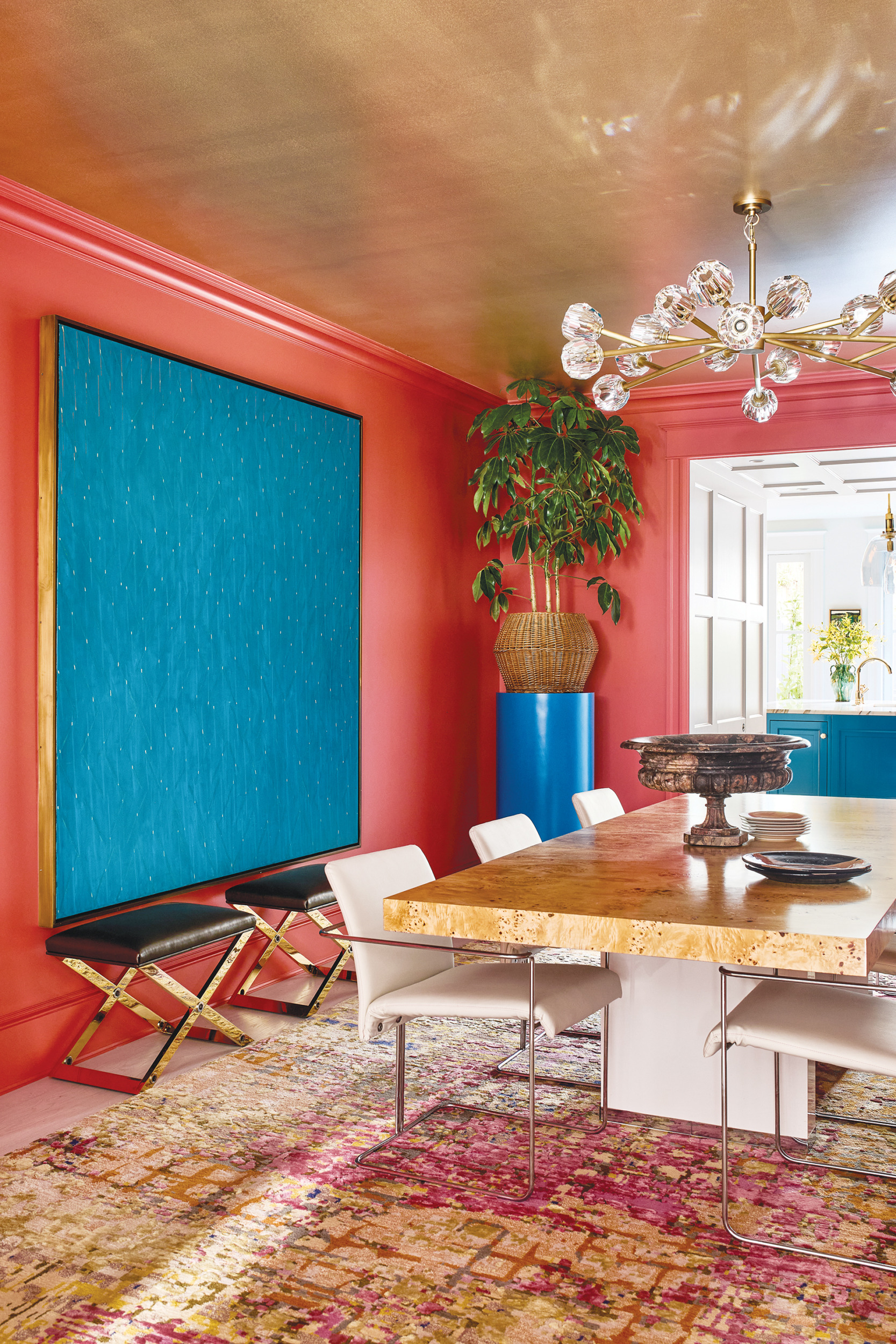 Vintage Karl Springer benches in front of a Power Boothe artwork | Home and Design Magazine