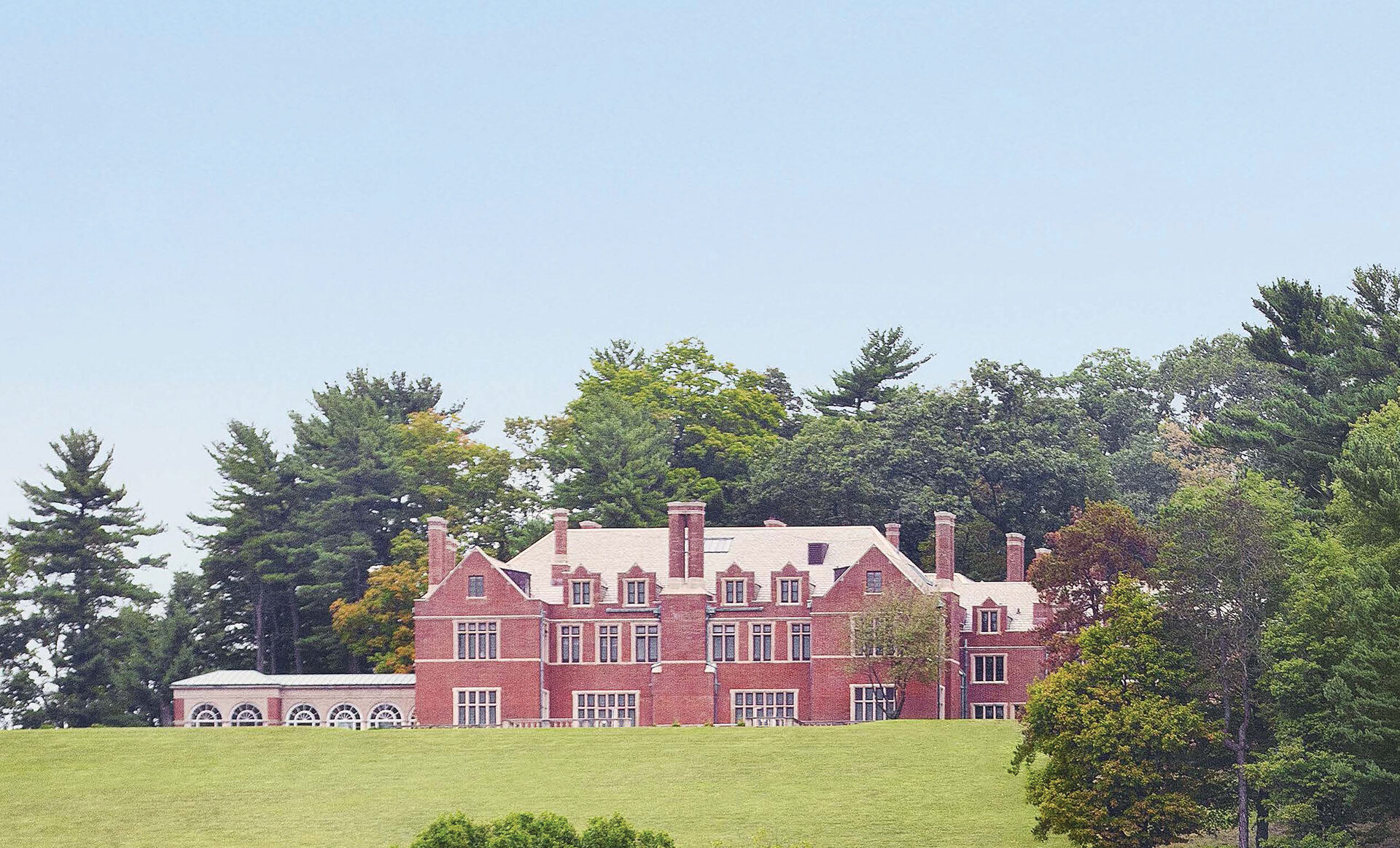The historic 1912 Tudor Revival manse of Pendry Natirar, restored by CosciaMoos Architecture, set in a pastoral New Jersey landscape