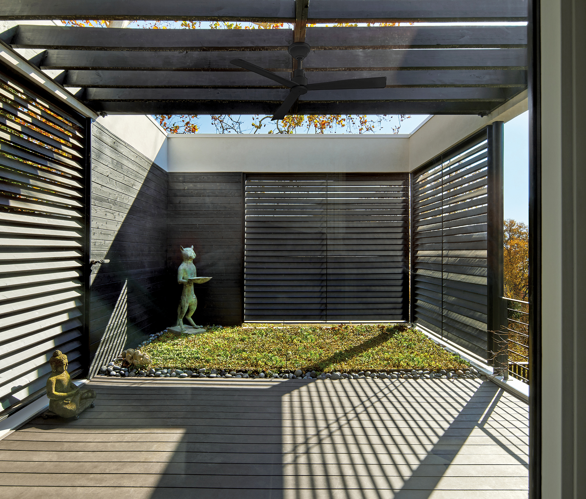East-facing courtyard with slatted screens, open roof, and green roof for rainwater absorption. | Home and Design Magazine