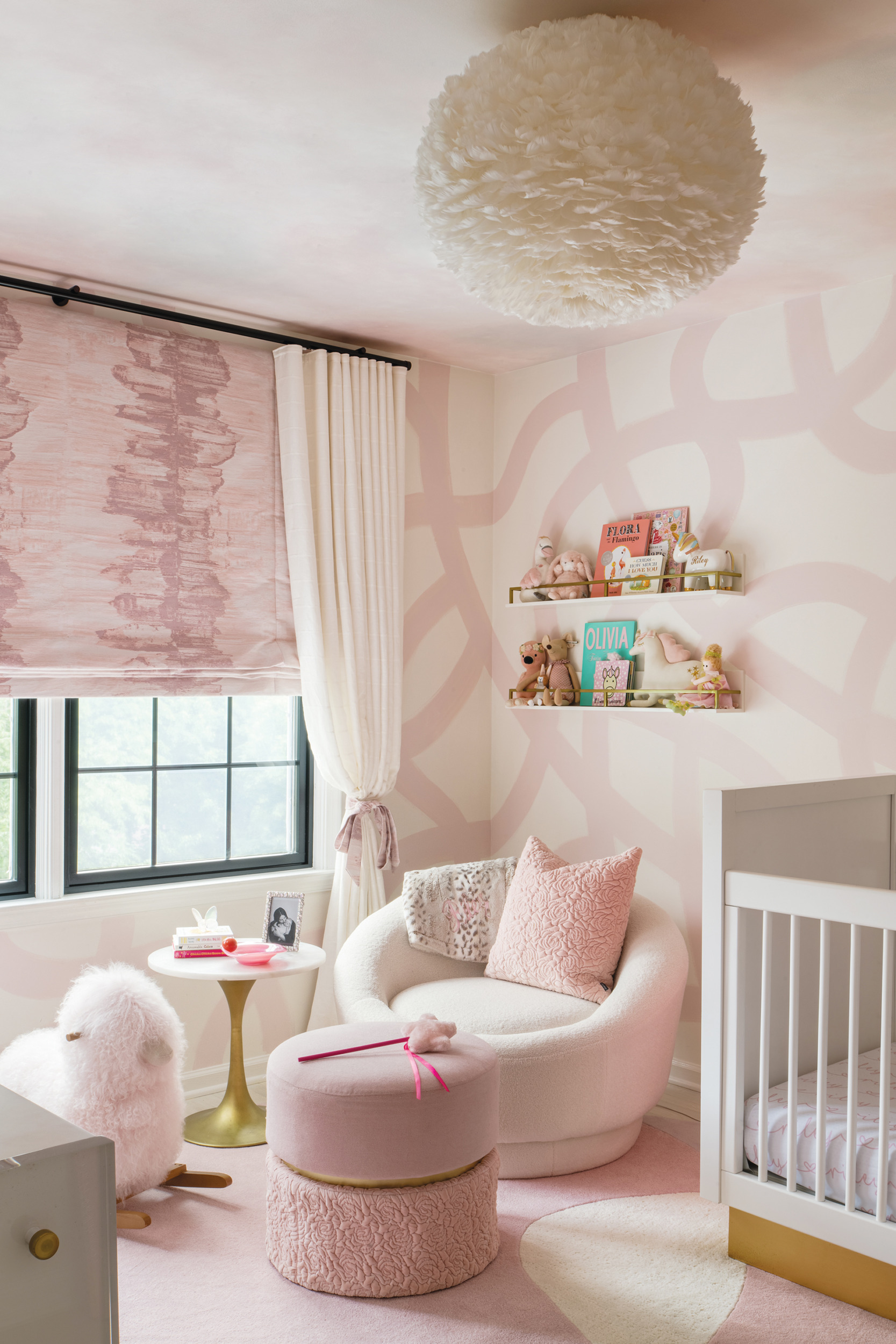 Older daughter’s room with pink tones, custom rug, and Donghia window treatment