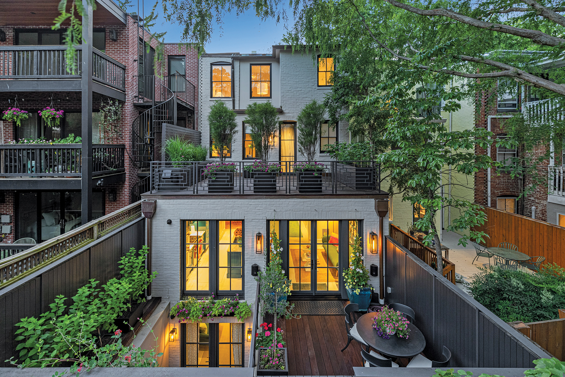 Rear view of a home showcasing a carefully proportioned addition respecting its lineage | Home and Design Magazine